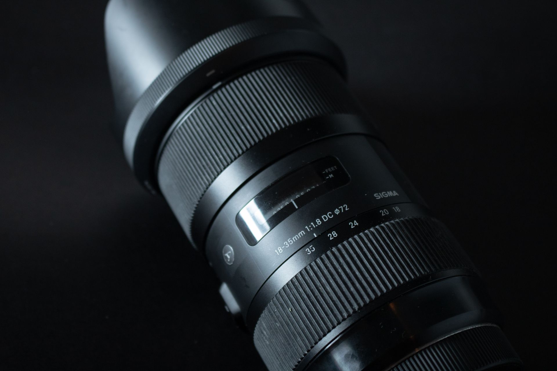 Detailed view of a Sigma 18-35mm lens showcasing classic camera equipment.