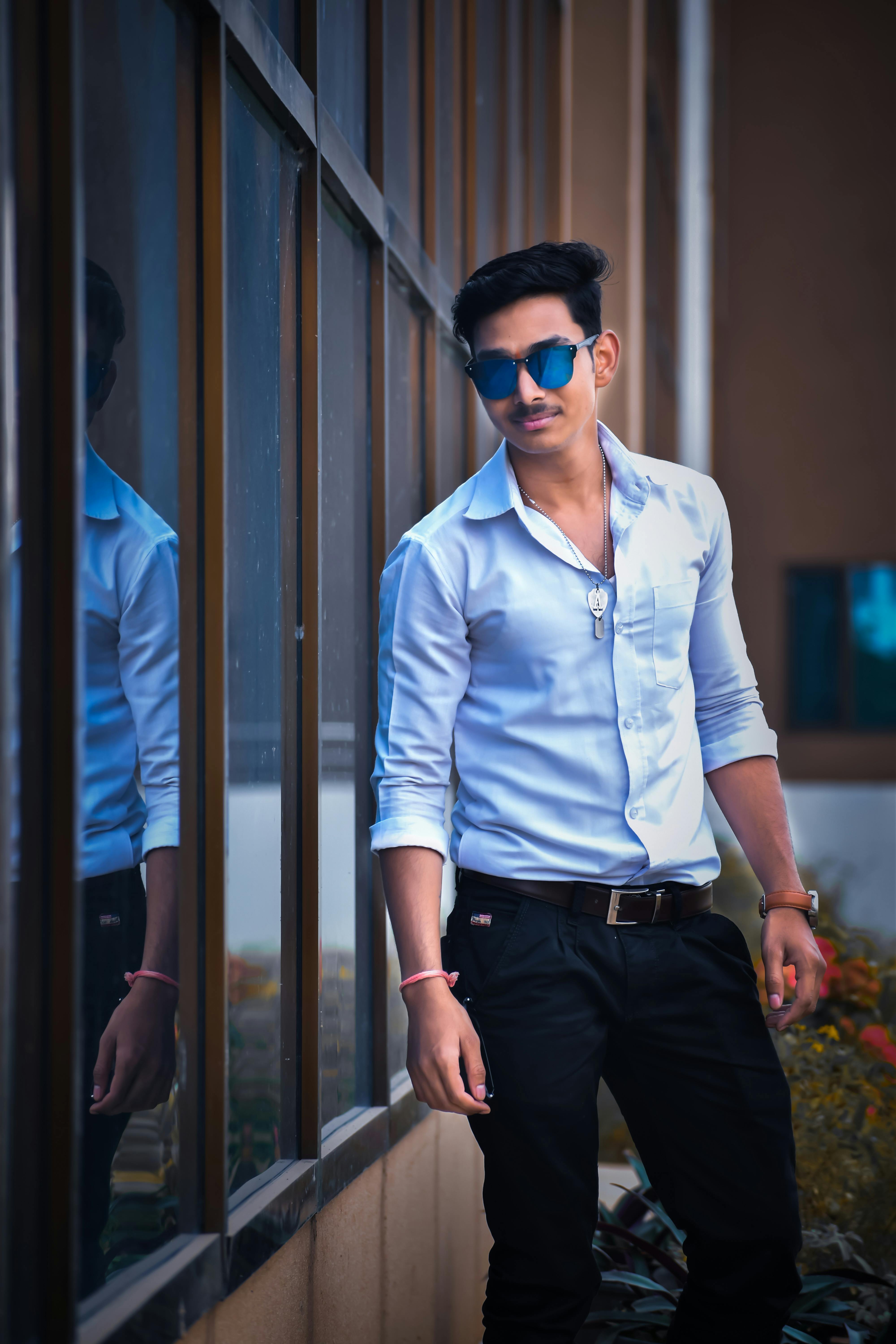 A photo of a forest trail winding through a lush green forest.