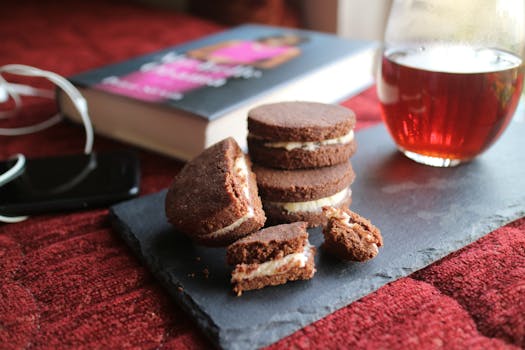 Enjoy homemade chocolate cookies with a glass of tea in a cozy setting.