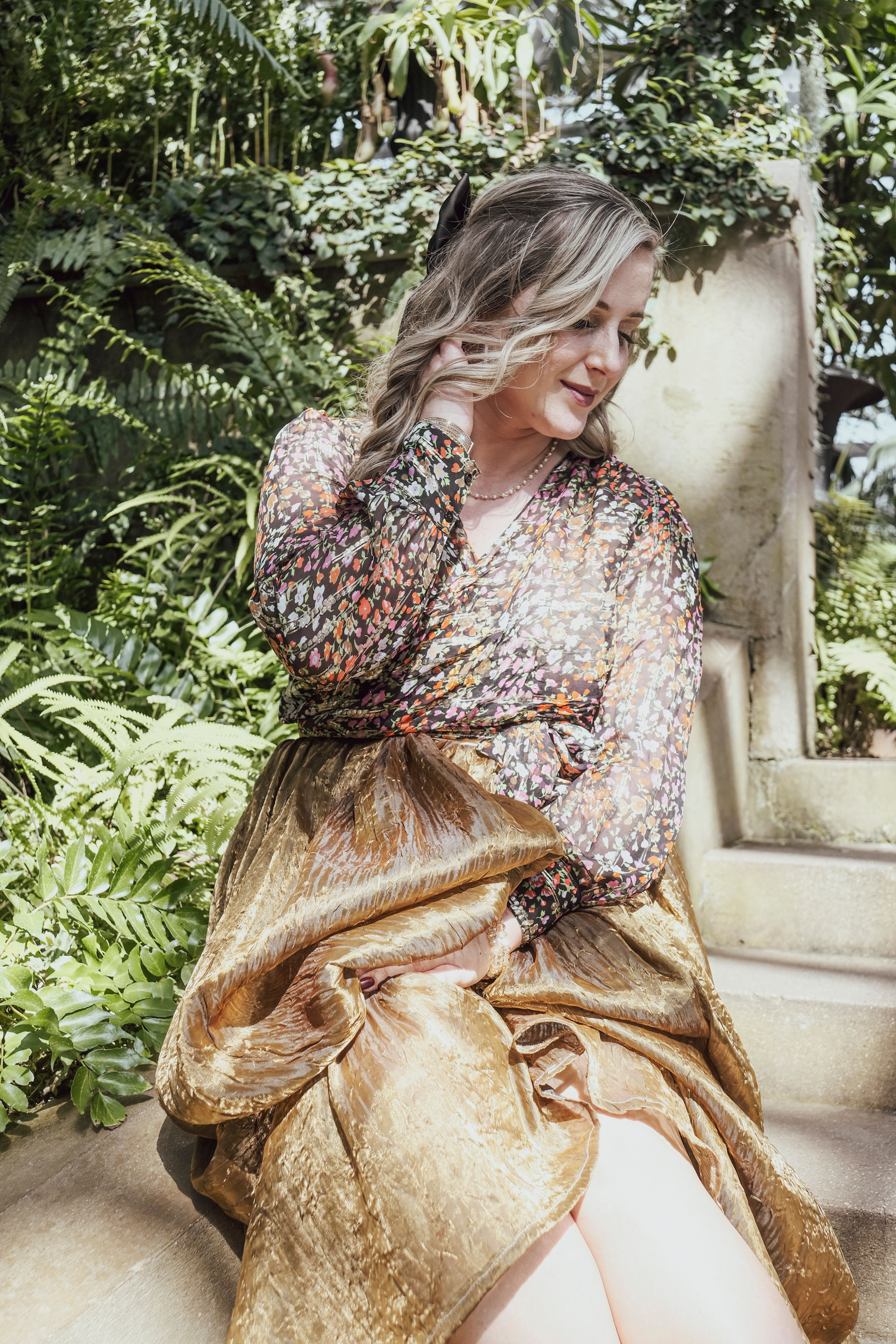 A Woman in a Dress Posing in a Botanical Garden · Free Stock Photo