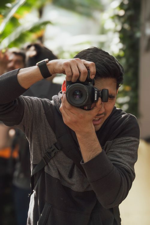 A Photographer Taking Pictures With A Camera Free Stock Photo A Photographer Taking Pictures With A Camera Free Stock Photo