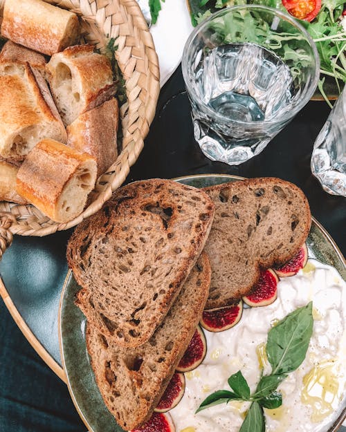 Free Bread on Plate Beside Glas Stock Photo