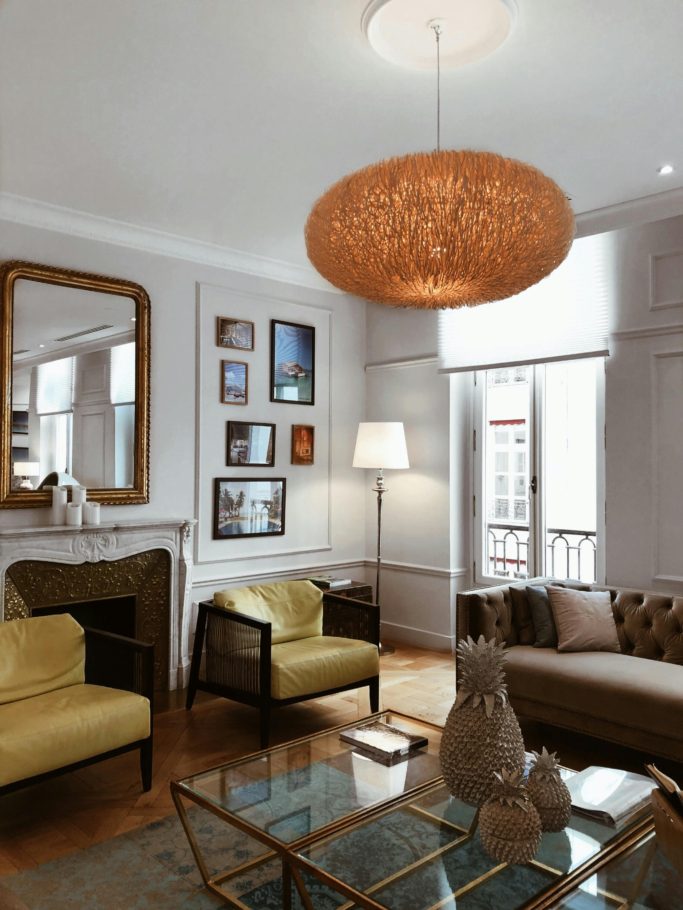 A detailed shot of a classic sculpture bust displayed on a modern side table.