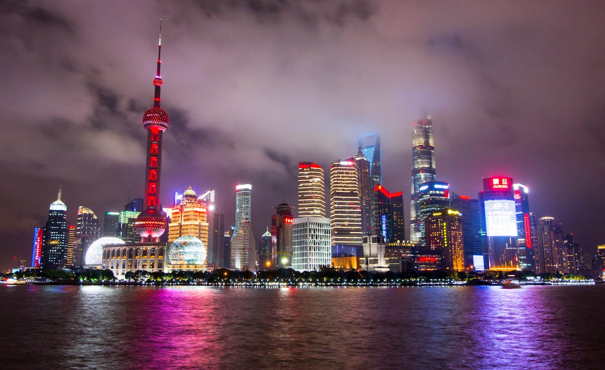 Lighted Buildings during Nighttime Near Body of Water China