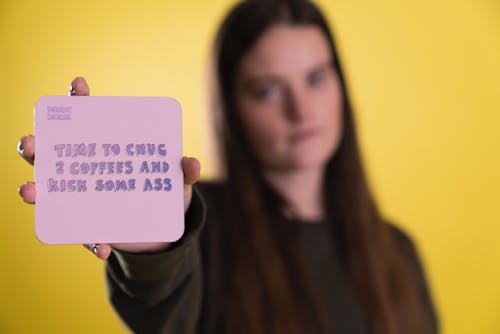 Free Person Holding Purple Sticky Note Stock Photo