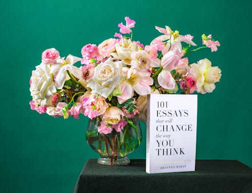 Free Book Beside Flowers Stock Photo