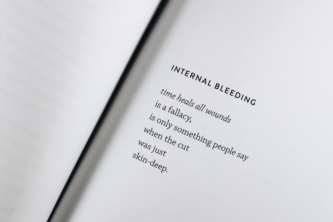 a black text poem on an open white page capturing the essence of heali