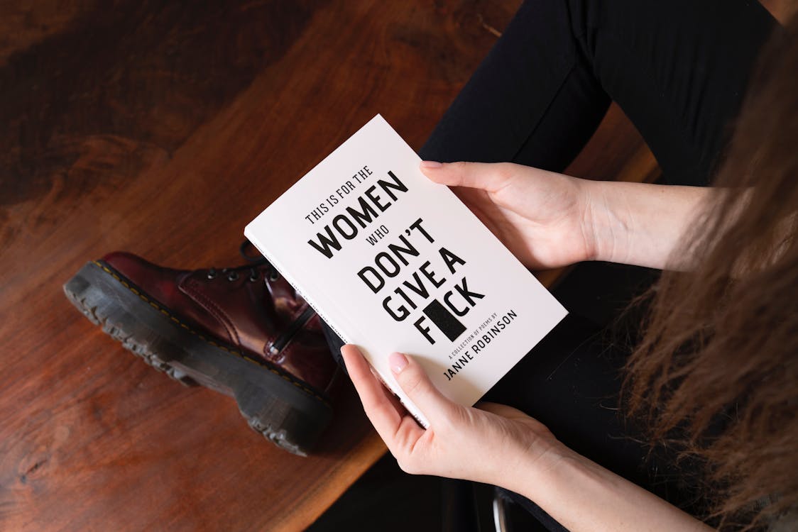 Free Woman Holding White Book Stock Photo
