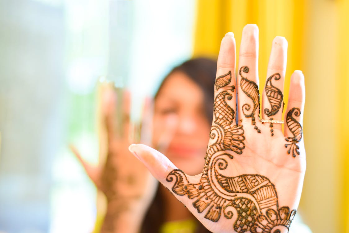 Free Selective Focus Photography of a Woman's Hand Mehndi Stock Photo