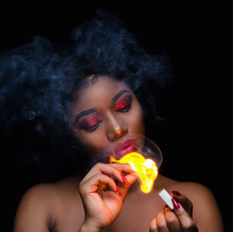 Photo Of A Woman Holding Match Stick With Fire