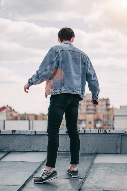 Free Photo of a Person Standing on Rooftop Stock Photo