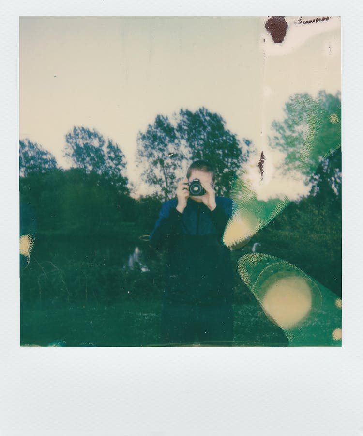 Instant Photo Of Man Taking A Photo