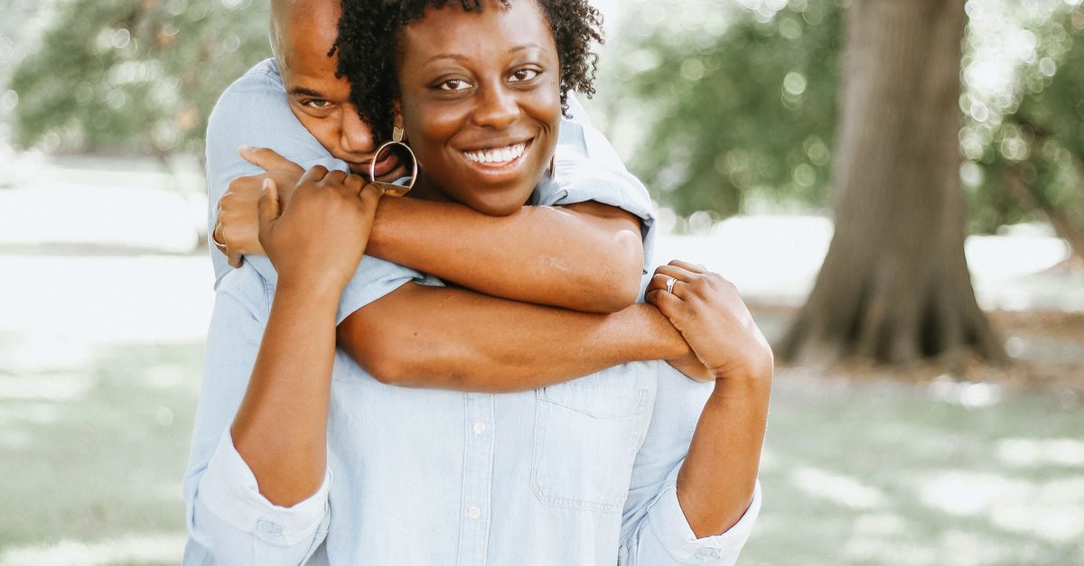 Man Hugging Woman on Her Back · Free Stock Photo