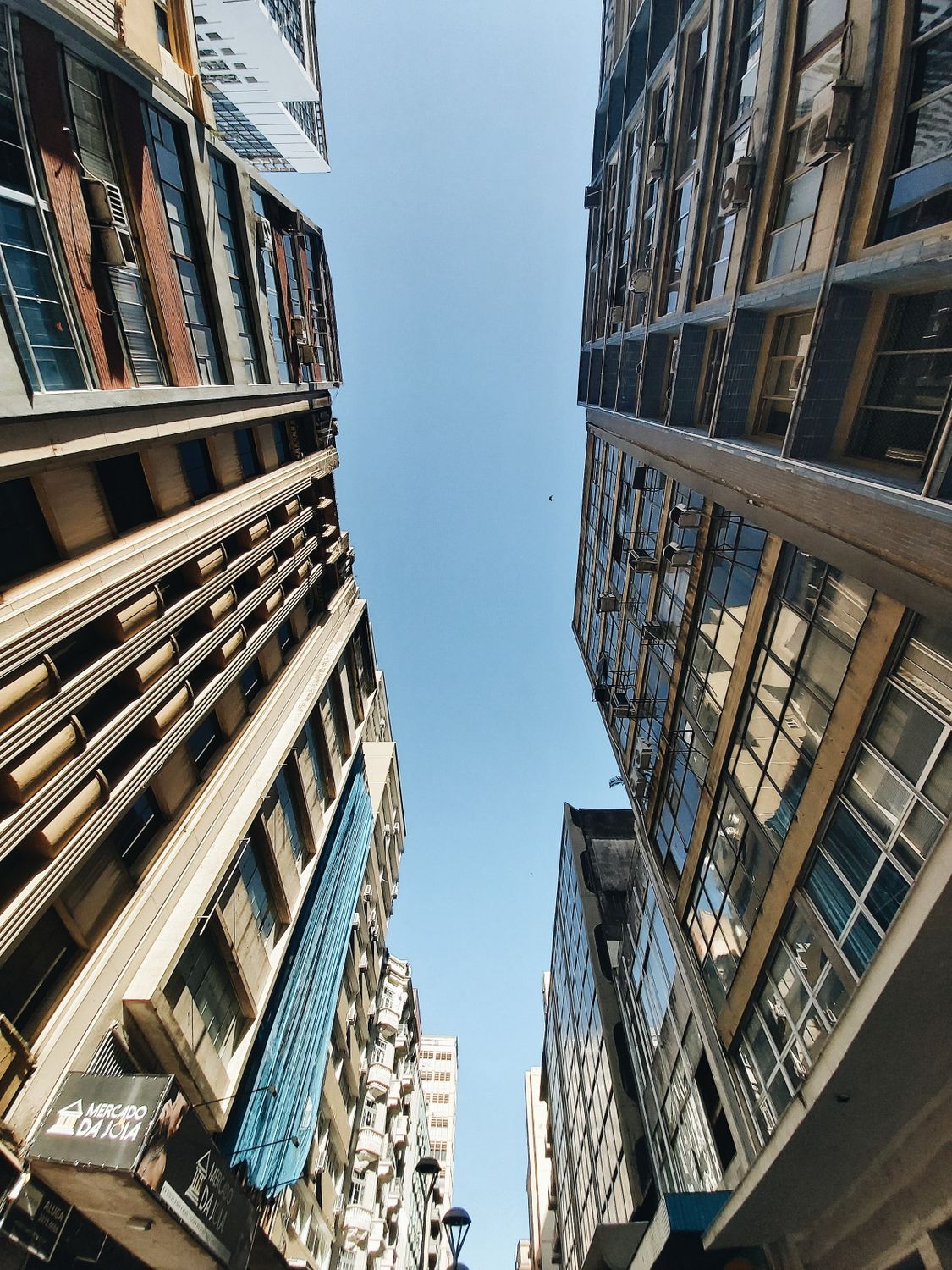 Blue Sky in Clearing between High Rise Buildings · Free Stock Photo