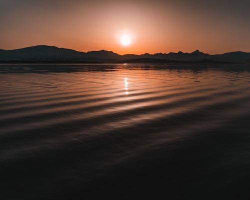 Безкоштовне стокове фото на тему «вода, горизонт, Захід сонця»