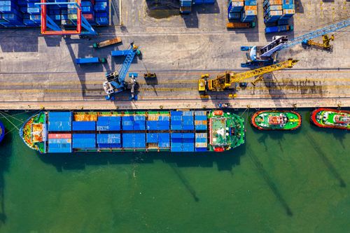 Free Aerial photograph showcasing vibrant cargo operations at a bustling port in North Jakarta, Indonesia. Stock Photo