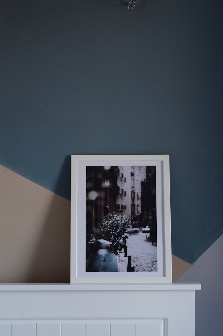 White Photo Frame Beside Wall