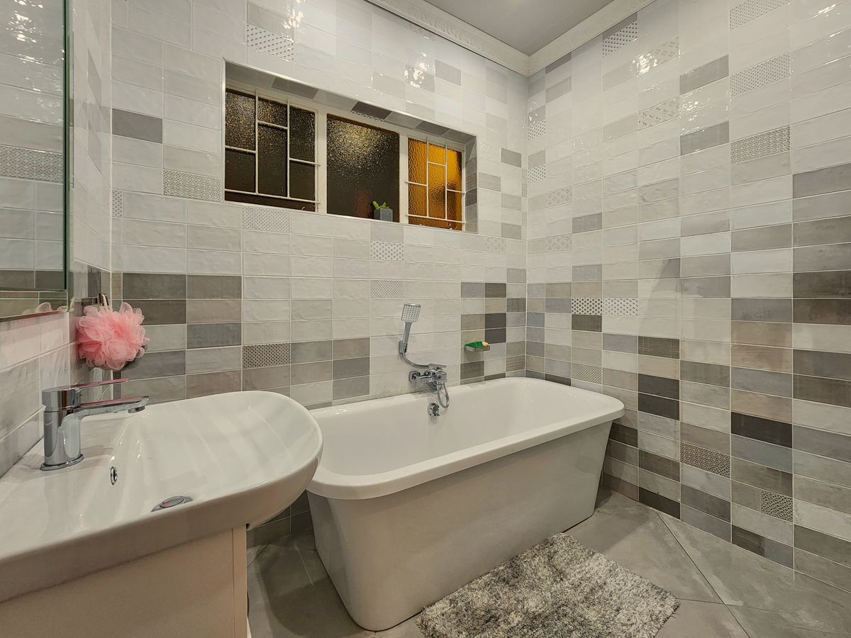 frameless wet room glass screen in a small bathroom