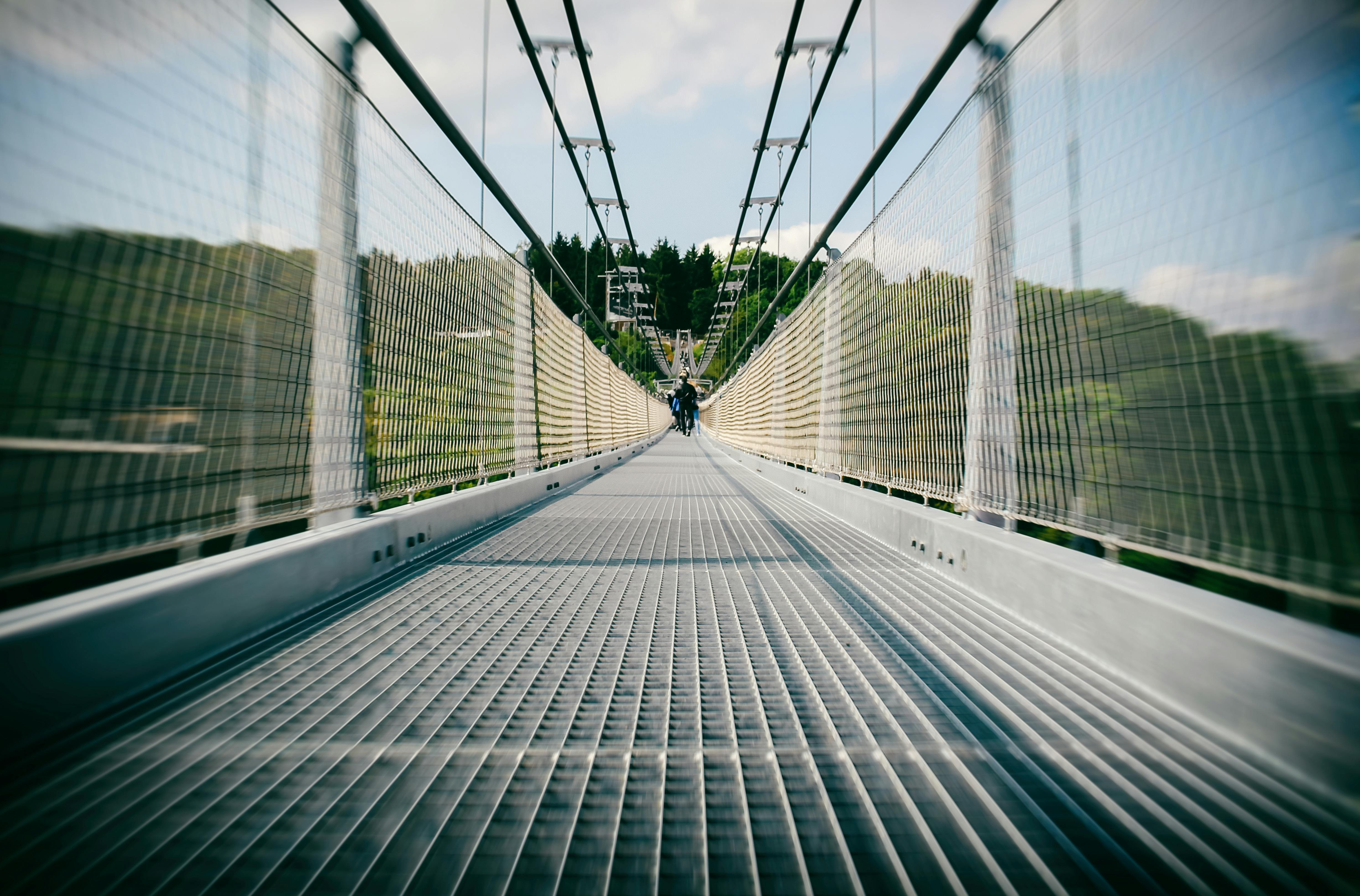 person standing on bridge