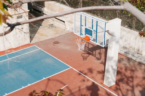 Free Top view of an empty basketball court with hoop and shadows in Jerusalem. Stock Photo