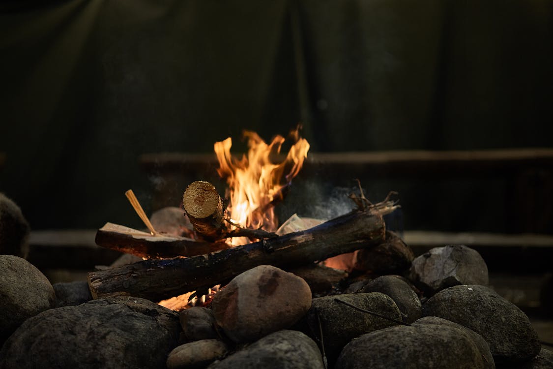 Burning Wood Above Rocks