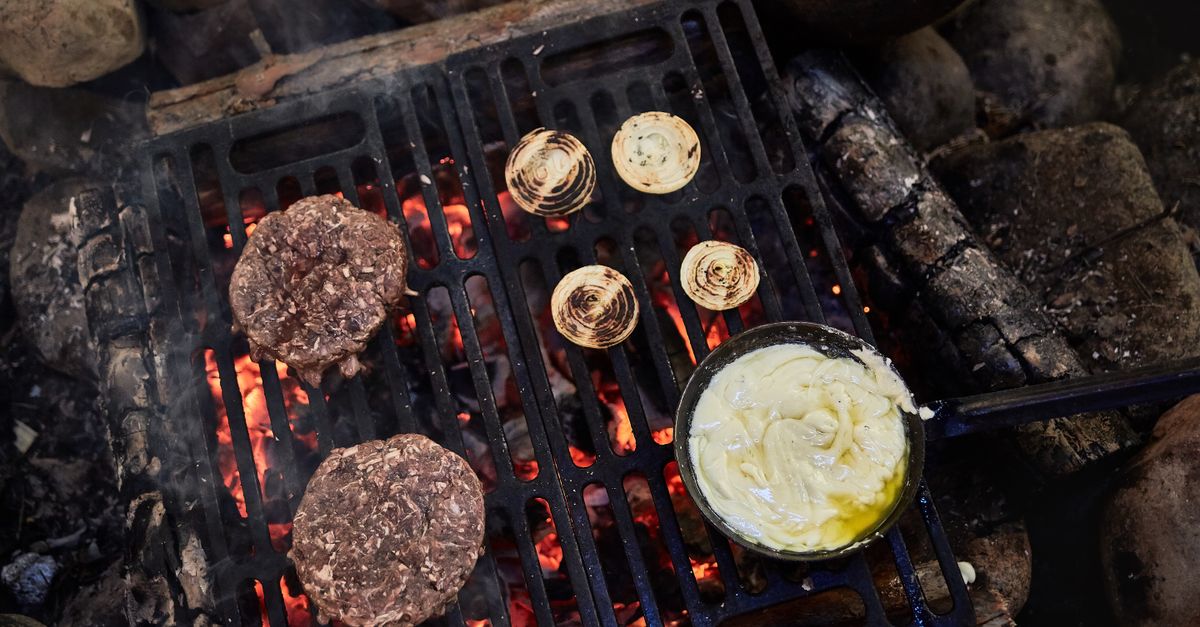 grilled ribeye steak on cast iron skillet with butter