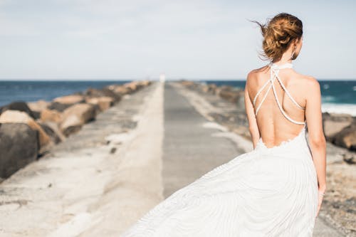 Woman Wearing White Halter Gown 