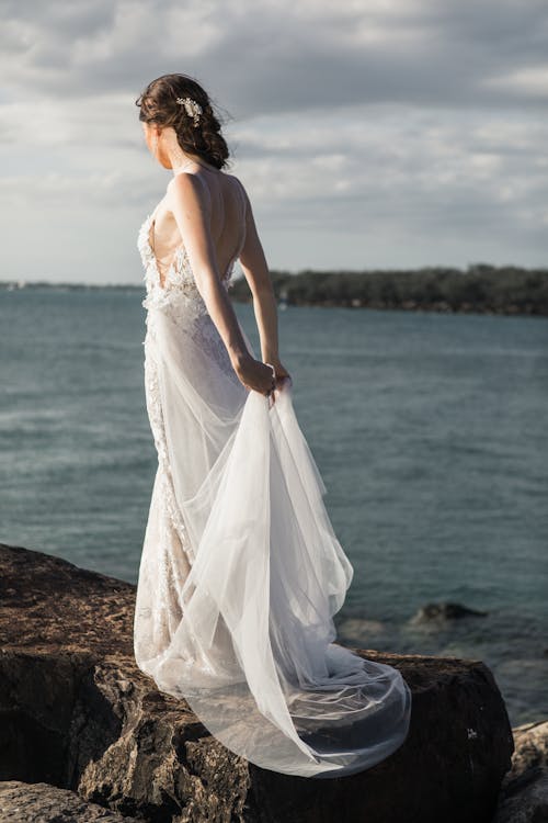 Woman Standing On Rock 