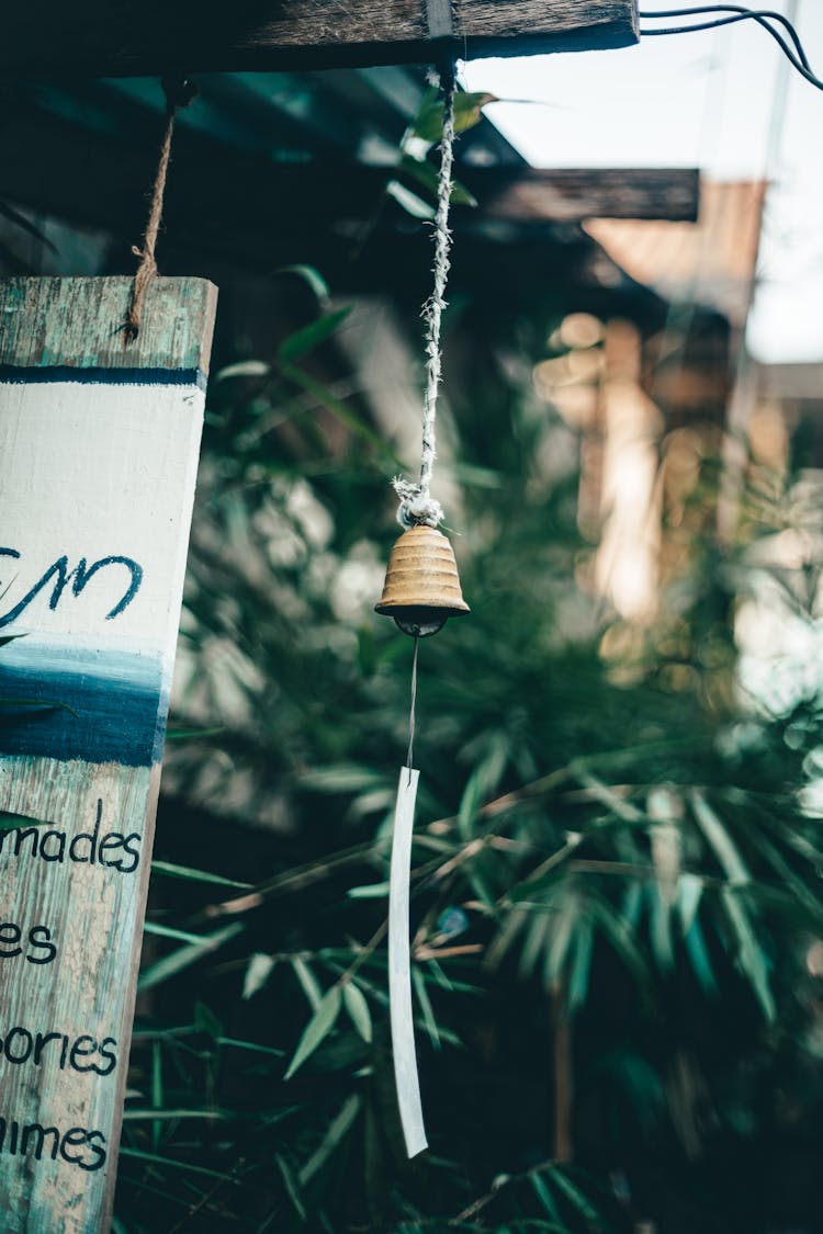 Selective Focus Photography Of Hanging Bell