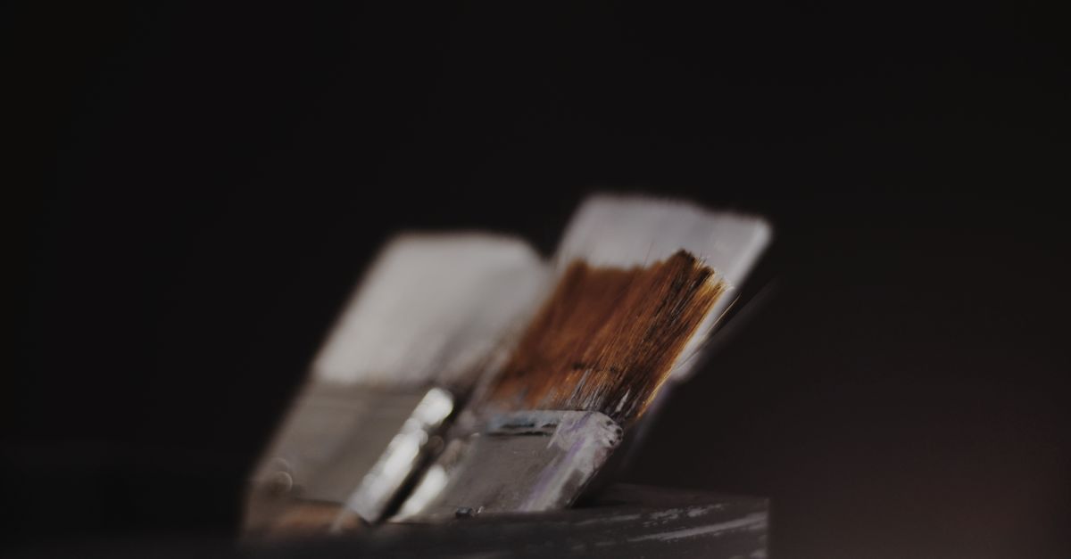 Artistic close-up of paint brushes highlighting texture and depth.