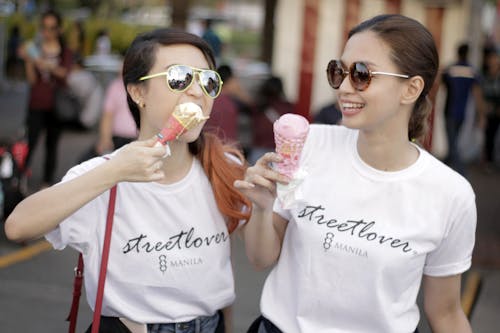 Women In White T-shirts Holding Ice Cream In Cones