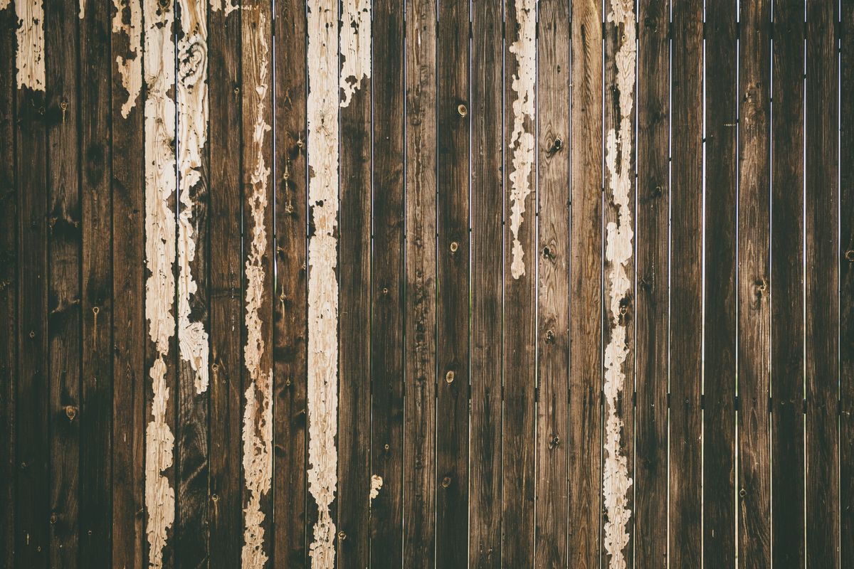 Weathered residential wood fence ready for professional cleaning