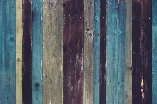 Vibrant wooden wall with rustic multicolored planks for creative backgrounds.