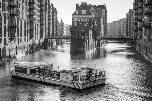 Free Stylish monochrome photo of a boat on the canals in Hamburg, Germany. Stock Photo