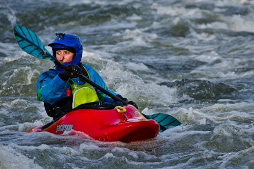 Free Person On Kayak Paddling In Body Of Water Stock Photo