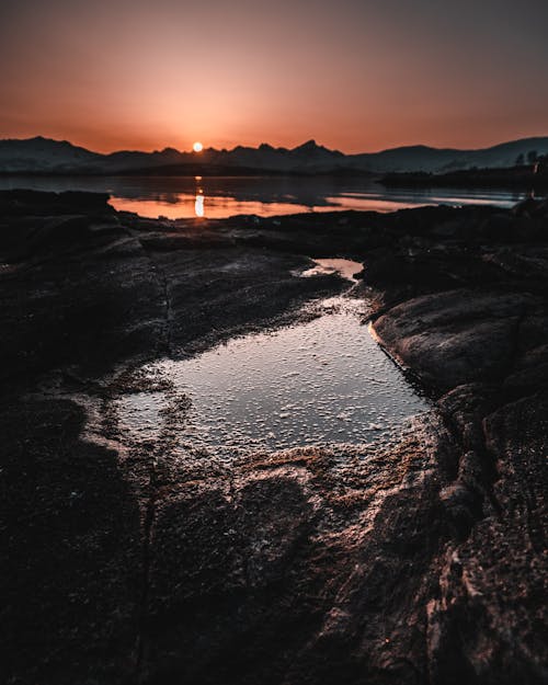 Body of Water With View Of Sunset