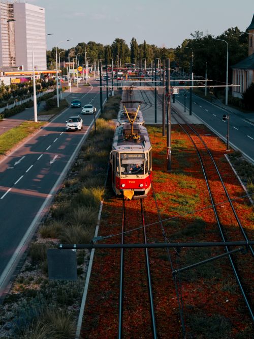 Free Aerial tramway and street view captured during sunset in Bratislava, Slovakia, highlighting urban transportation. Stock Photo