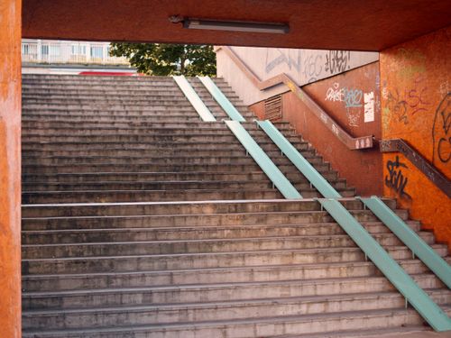 Free Concrete stairs with graffiti in Bratislava underpass, featuring railings and urban scenery. Stock Photo