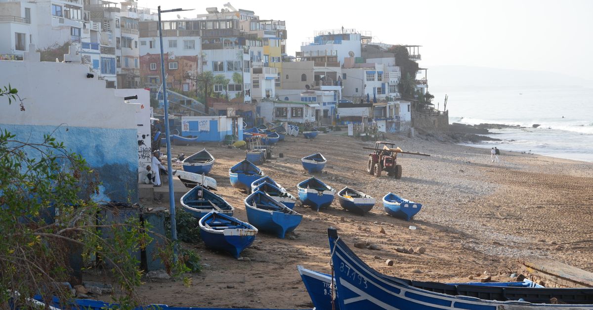 Charming seaside view of fishing boats on Taghazout beach, Souss-Massa, Morocco.