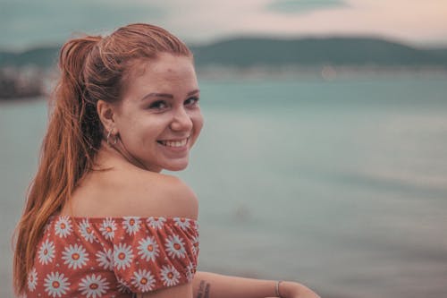 Woman Smiling On Seashore