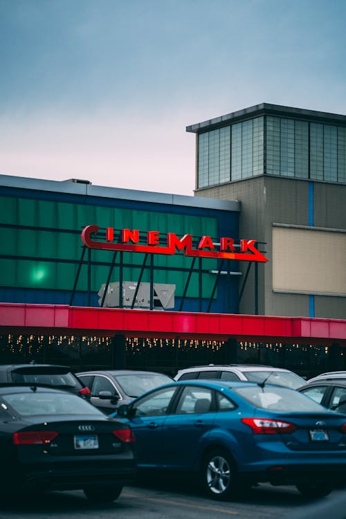 Vehicles Parked in Front of Cinemark Building