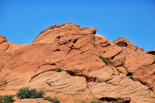 Free Red rock formations under a clear blue sky, showcasing arid landscape beauty. Stock Photo