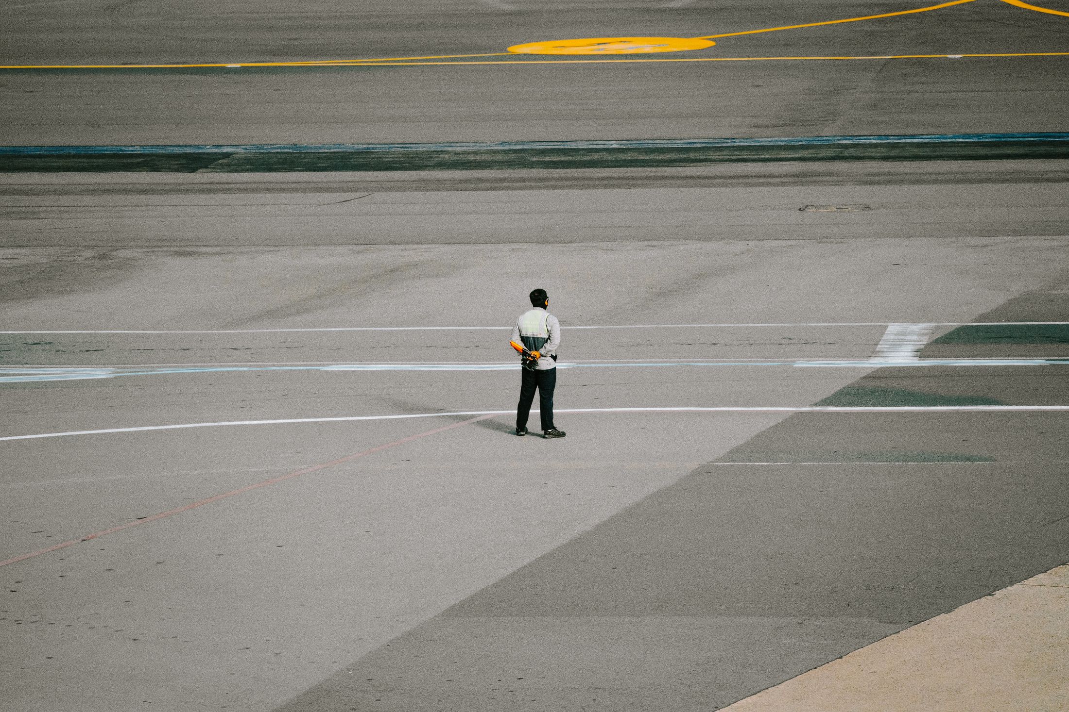 Ground staff member working at airport runway
