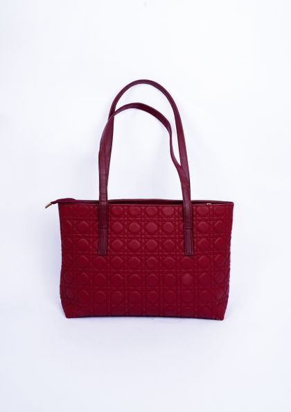 Red leather handbag on a white backdrop — Muneeb Malhotra on Pexels
