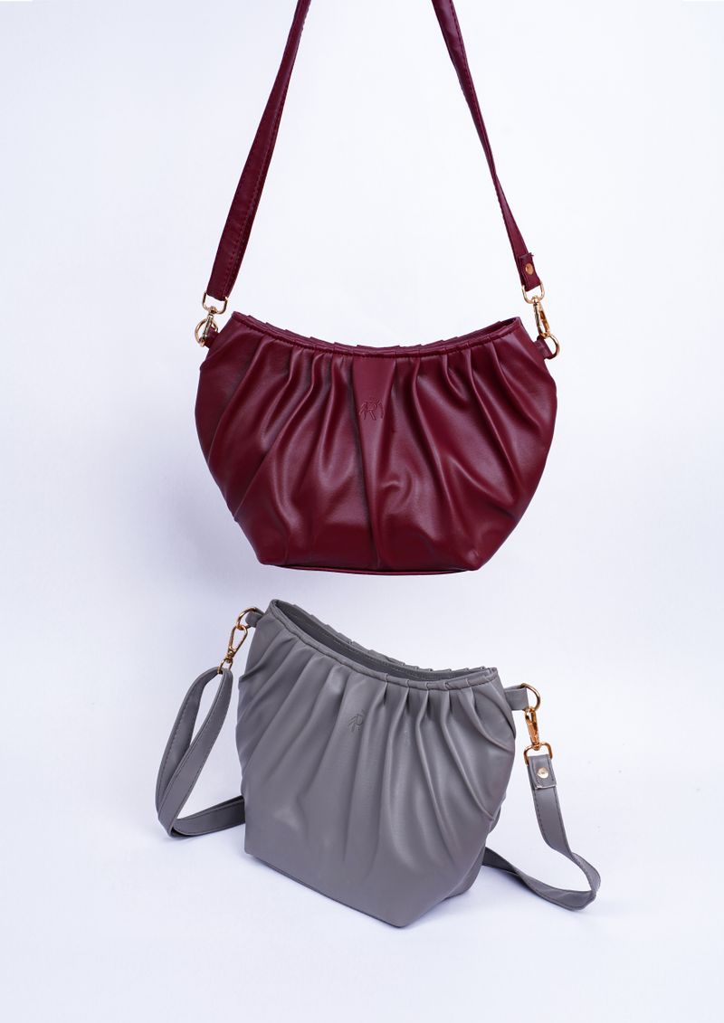Red and gray leather shoulder bags styled