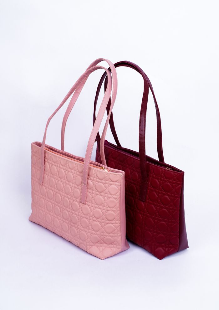 Quilted textured bags in blush and deep red — photo by Muneeb Malhotra on Pexels