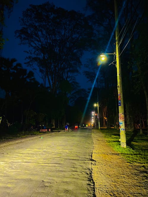 işık demeti, parlak ışık, şehir yolu içeren Ücretsiz stok fotoğraf