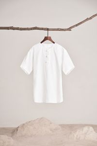 White linen shirt on a wooden hanger — dayong tien on Pexels