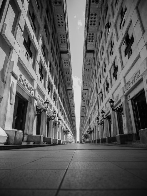 Free Black and white photo of symmetrical buildings in Santo Domingo, Dominican Republic. Stock Photo