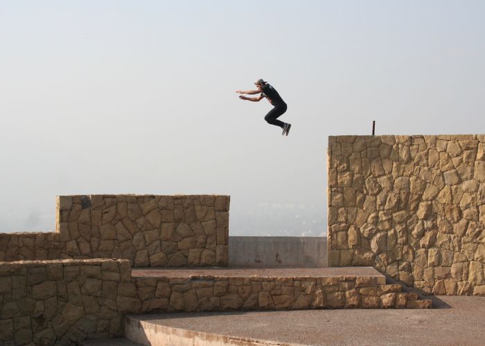 Athlete jumping between walls